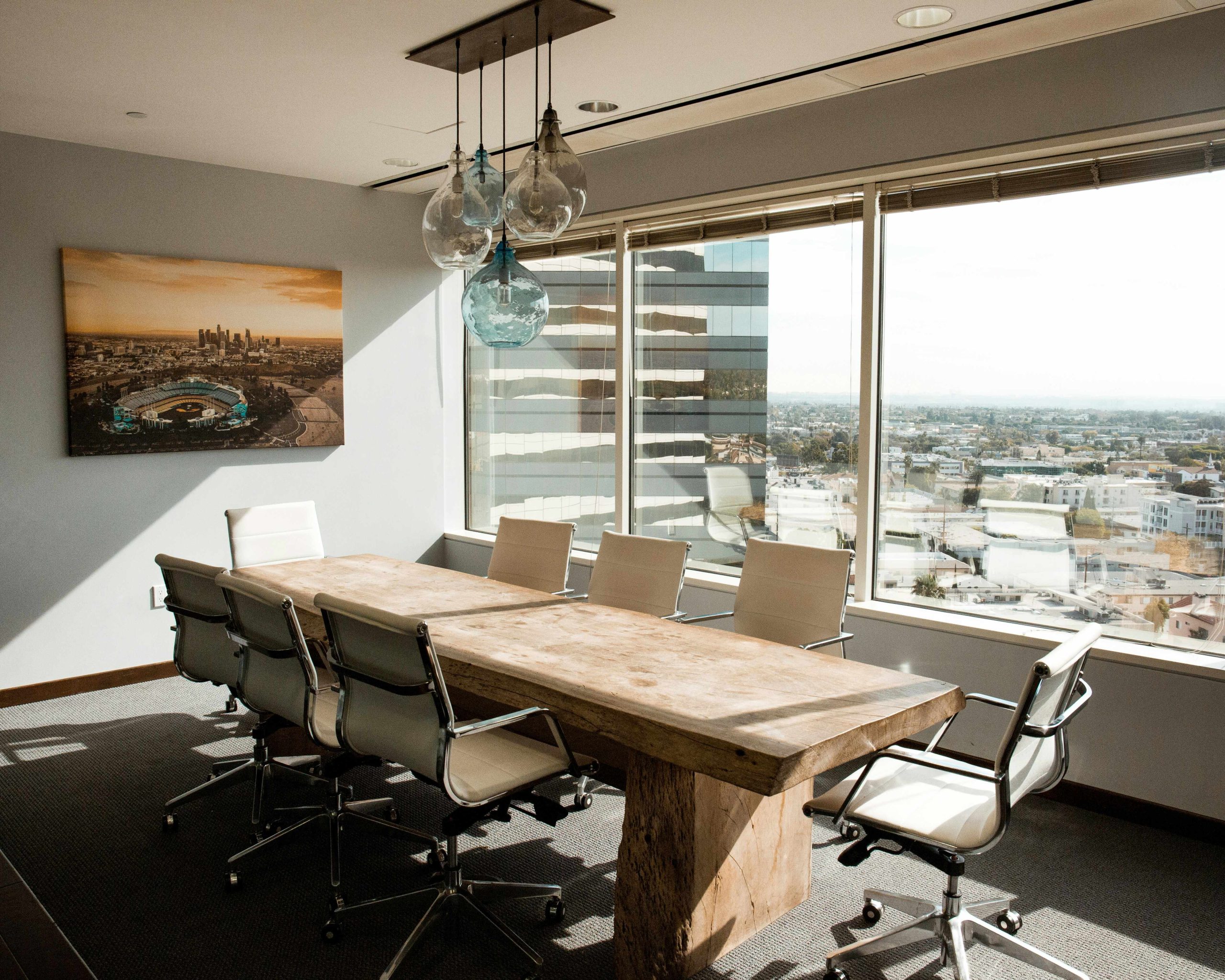 Pre-owned office furniture set up in an executive meeting room with a view of the city right below the meeting room